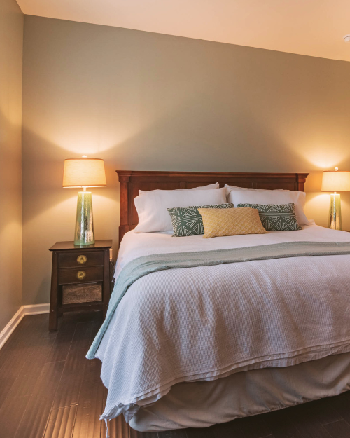 green and yellow quiet luxury master bedroom