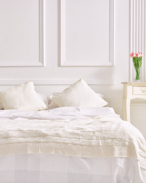 white linen quiet luxury master bedroom