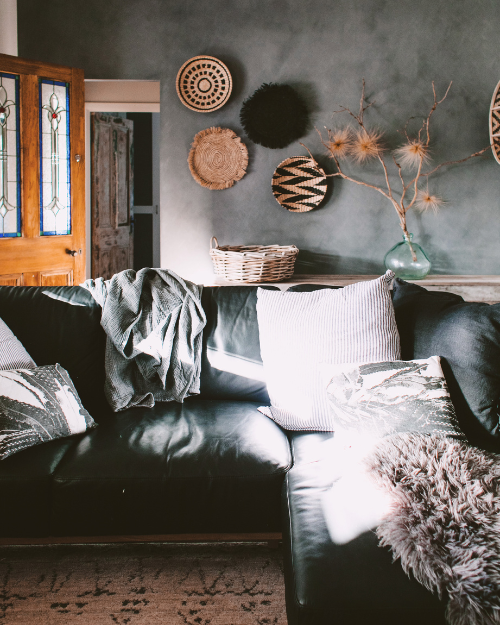 black couch cozy earthy living room