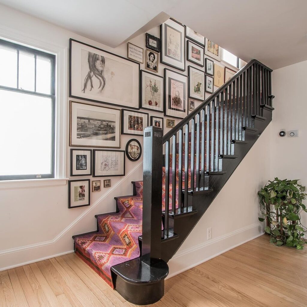 staircase with photo wall