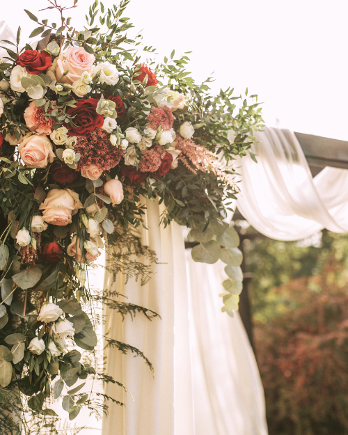 fall wedding arch with flowers