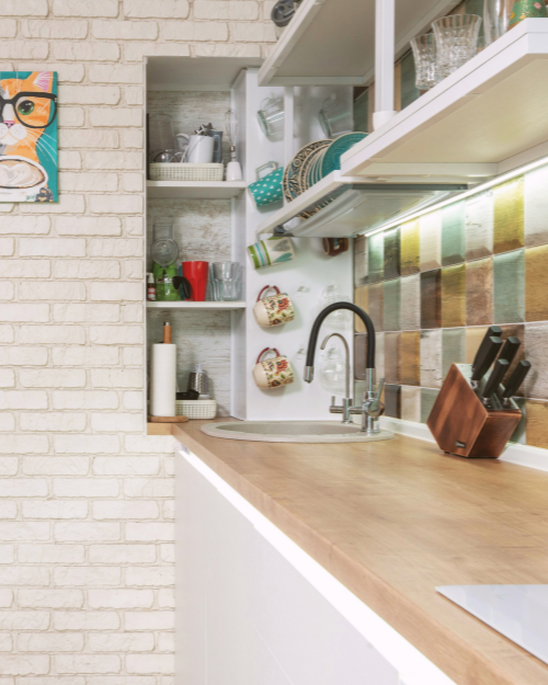 small kitchen with colored tiles