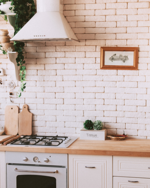 small kitchen with brick