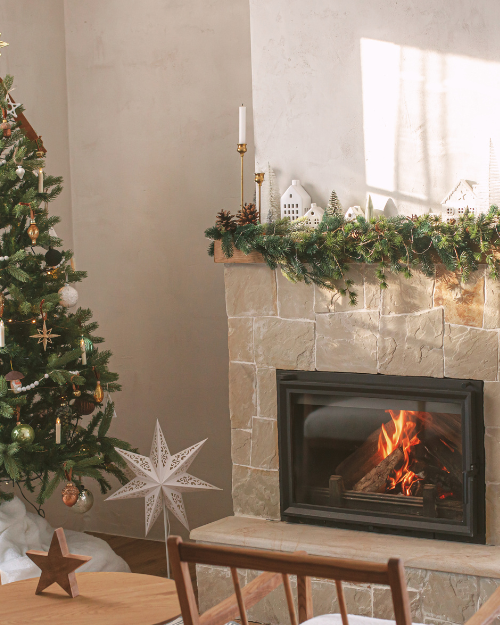 mantel with christmas decor and tree