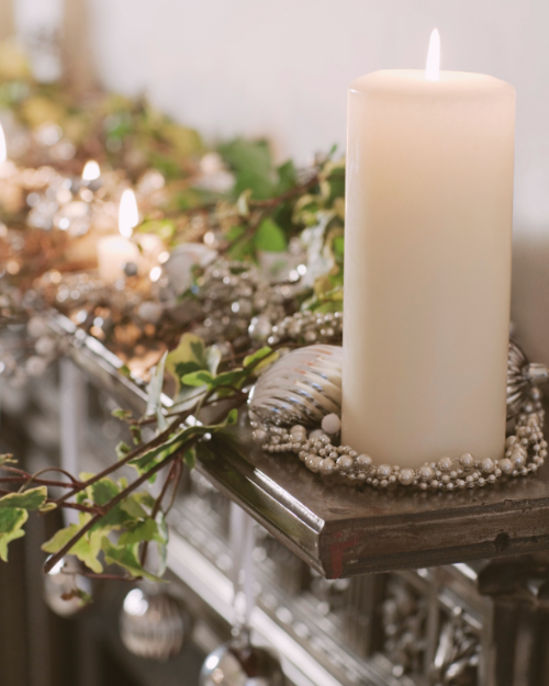 simple christmas mantel decor with candle