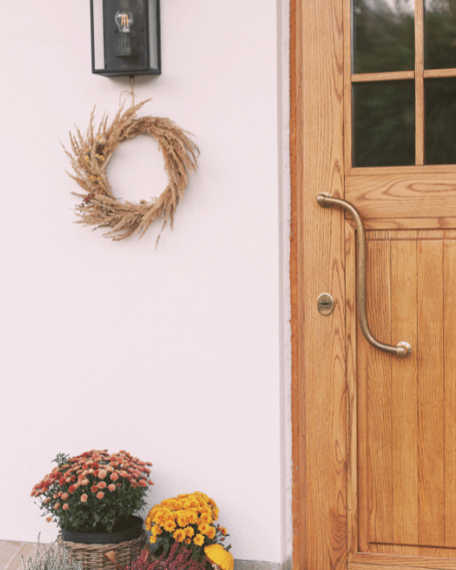 rustic wreath and decor on front porch