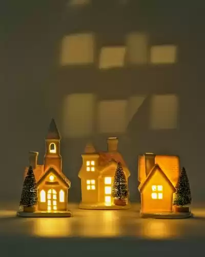 DN DECONATION Light up Christmas Ceramic Village Houses White Christmas Porcelain Village with Frosted Bottle Brush Xmas Trees Holiday House Figurine for Winter Table Decoration 3Pcs