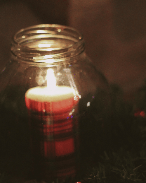 diy tartan candle lit inside a glass jar