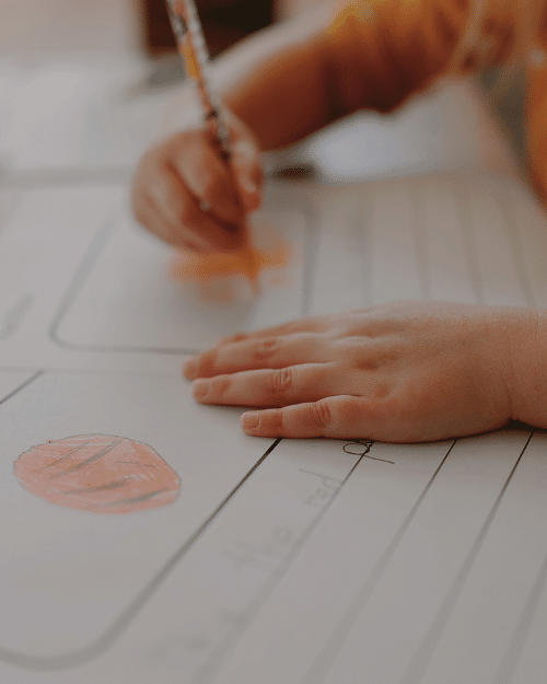 children coloring in work sheets